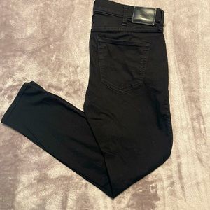 Black Hollister skinny jeans. Size 36 . (W/ rips)